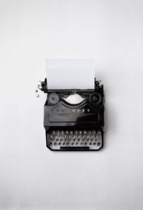 typewriter viewed from above on white background